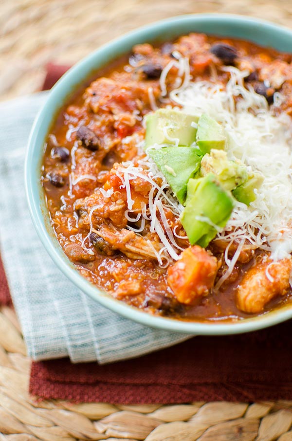 Slow cooker chicken quinoa chili is the perfect winter dish with sweet potatoes, black beans and tomatoes. | livinglou.com