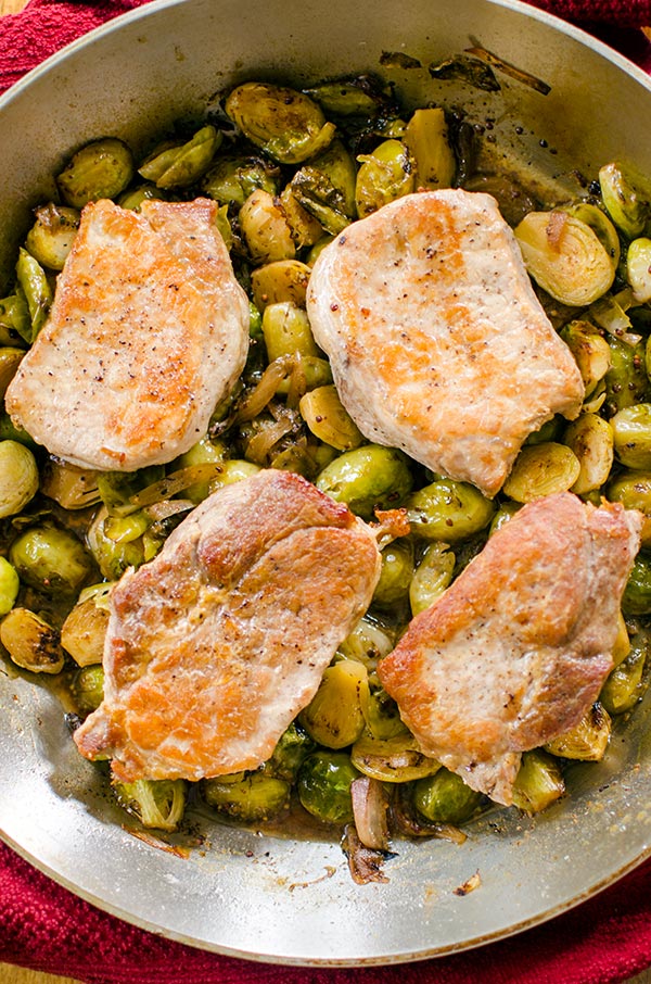 A quick dinner, this recipe for one-pan pork chops and Brussels sprouts is an easy dinner for the whole family. | livinglou.com