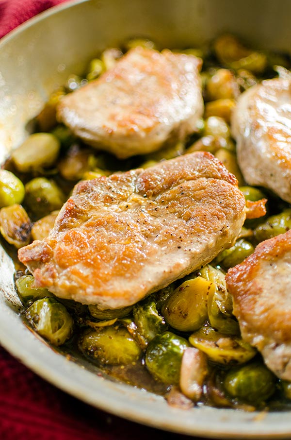 A quick dinner, this recipe for one-pan pork chops and Brussels sprouts is an easy dinner for the whole family. | livinglou.com
