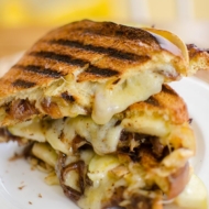 A gooey grilled cheese sandwich made with caramelized onions, green apple and horseradish. | livinglou.com