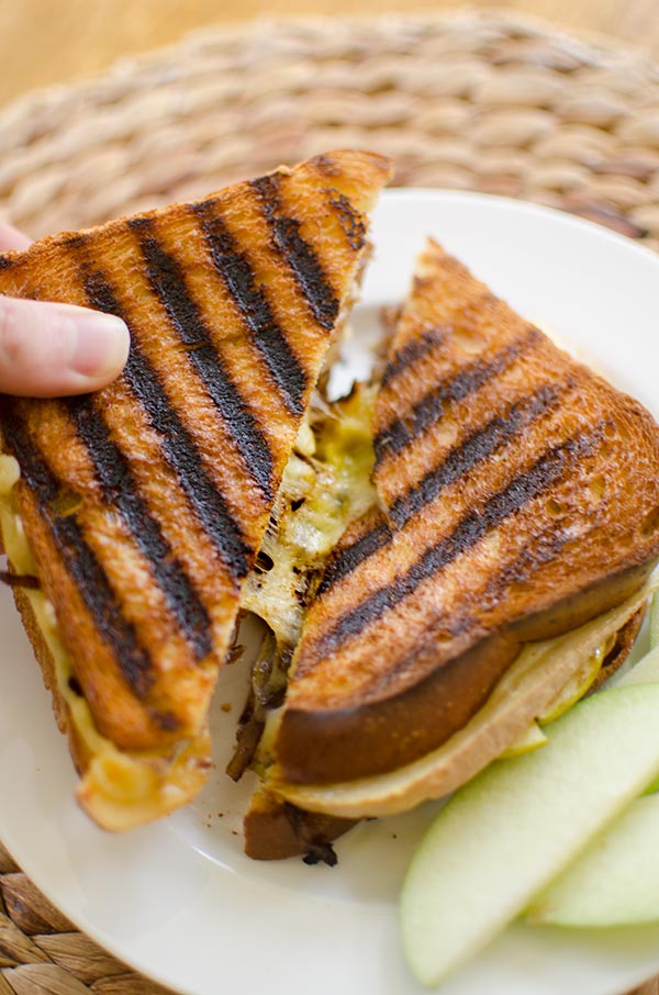 A gooey grilled cheese sandwich made with caramelized onions, green apple and horseradish. | livinglou.com