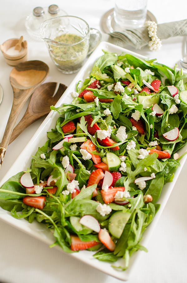 Strawberry spinach salad with almonds, arugula and a homemade poppy seed dressing with fresh thyme. | livinglou.com