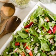 Strawberry spinach salad with almonds, arugula and a homemade poppy seed dressing with fresh thyme. | livinglou.com