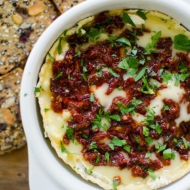 Baked Camembert cheese with sun dried tomatoes and red pepper jelly is the perfect appetizer. | livinglou.com