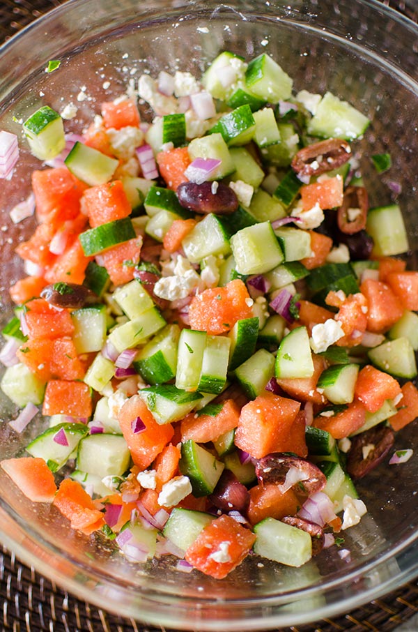 Greek watermelon feta salad is a refreshing summer salad with a lime vinaigrette and fresh mint. | livinglou.com