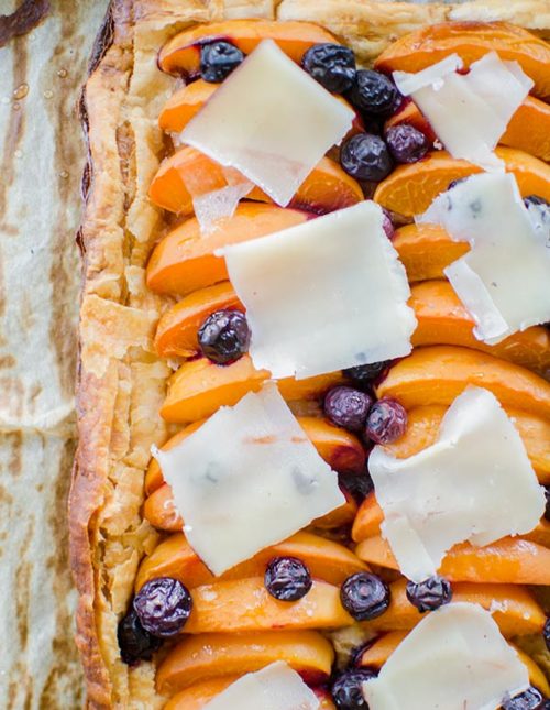 Make the perfect summer dessert with this simple puff pastry apricot blueberry tart topped with Tipsy cheese. | livinglou.com