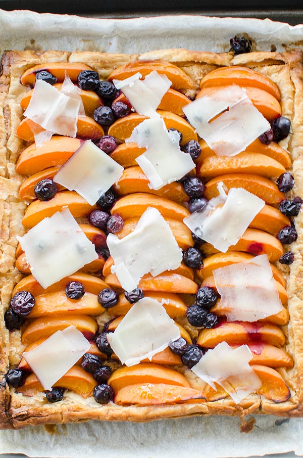 Make the perfect summer dessert with this simple puff pastry apricot blueberry tart topped with Tipsy cheese. | livinglou.com