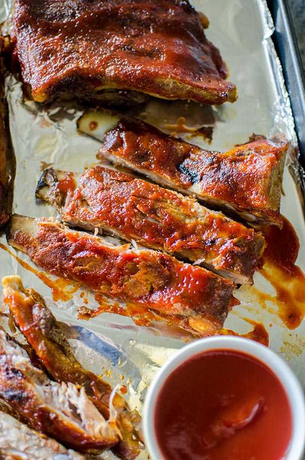 Easy slow cooker pork ribs with a homemade smoky barbecue sauce. | livinglou.com