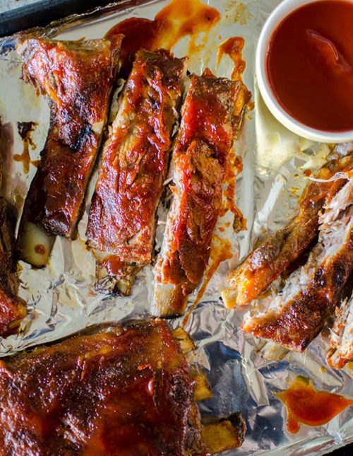 Easy slow cooker pork ribs with a homemade smoky barbecue sauce. | livinglou.com