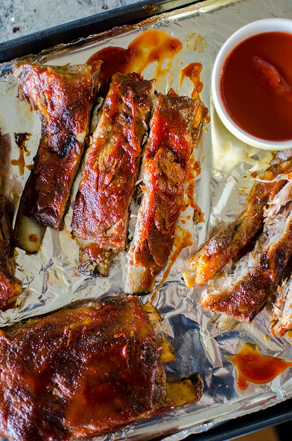 Easy slow cooker pork ribs with a homemade smoky barbecue sauce. | livinglou.com