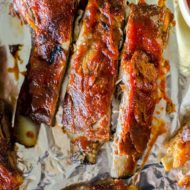 Easy slow cooker pork ribs with a homemade smoky barbecue sauce. | livinglou.com