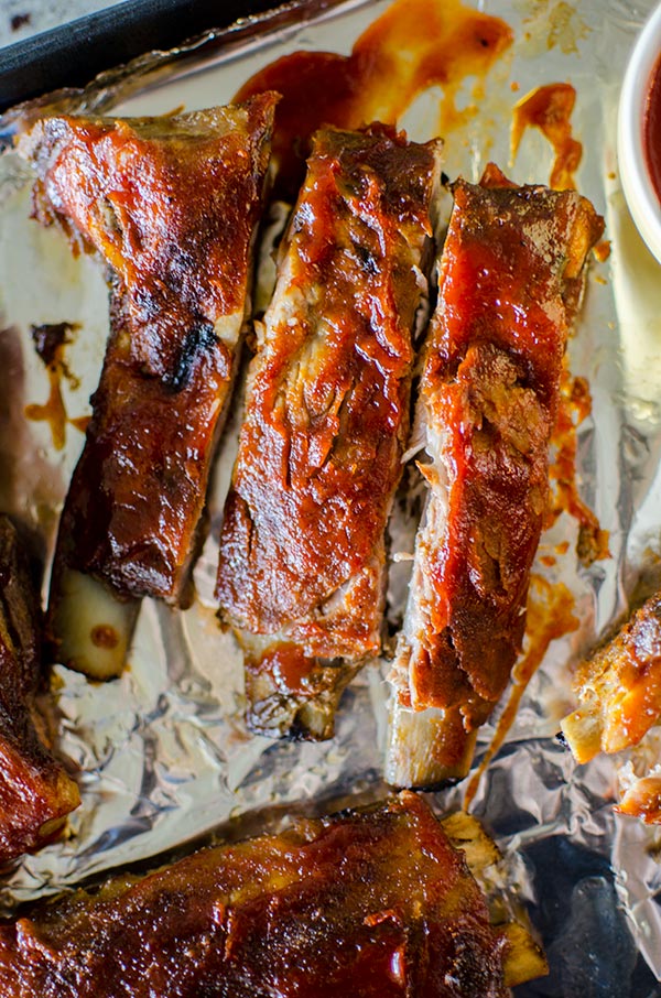 Easy slow cooker pork ribs with a homemade smoky barbecue sauce. | livinglou.com