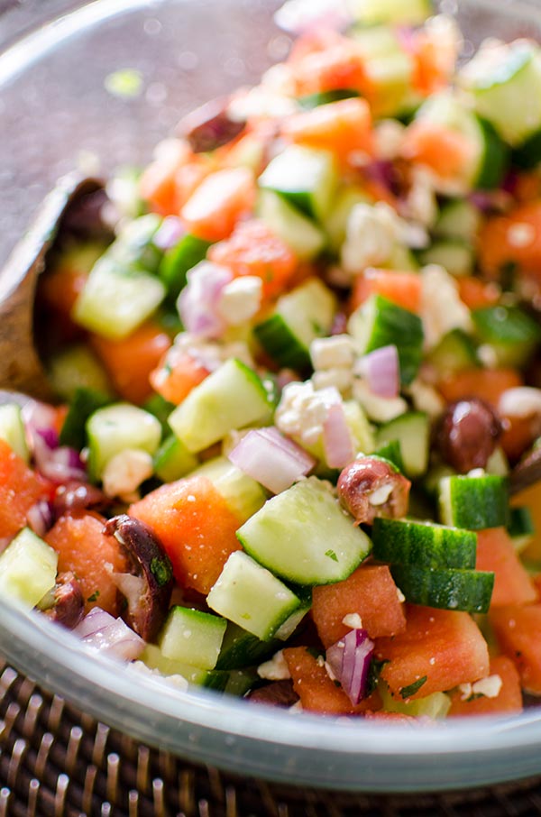 Greek watermelon feta salad is a refreshing summer salad with a lime vinaigrette and fresh mint. | livinglou.com