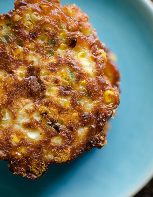 Cheesy corn fritters are the perfect summer side dish with fresh corn, cheddar cheese, green onions and jalapenos. | livinglou.com
