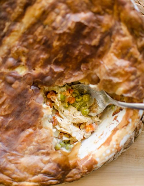 Turn Thanksgiving leftovers into a delicious turkey pot pie with carrots, parsnips, peas and a delicious and easy puff pastry crust.