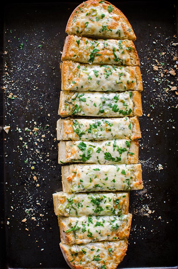 Cheesy herbed garlic bread is the perfect appetizer for a crowd.| livinglou.com