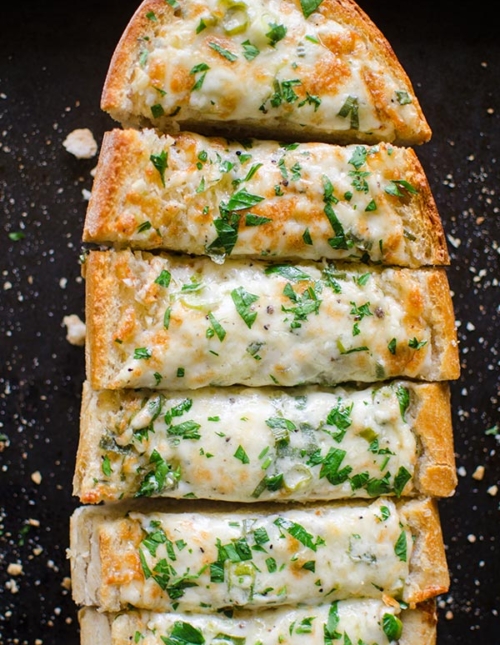 Herbed cheesy garlic bread is the perfect appetizer for a crowd.| livinglou.com