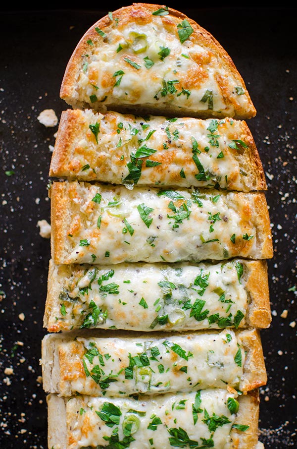 Cheesy herbed garlic bread is the perfect appetizer for a crowd.| livinglou.com