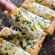 Herbed cheesy garlic bread is the perfect appetizer for a crowd.| livinglou.com