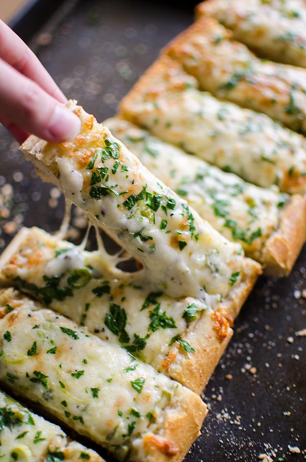 Cheesy herbed garlic bread is the perfect appetizer for a crowd.| livinglou.com