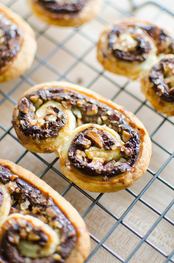 Puff pastry palmiers are an impressive dessert that are so easy to make with frozen puff pastry, chocolate, pecans and cream cheese. | livinglou.com