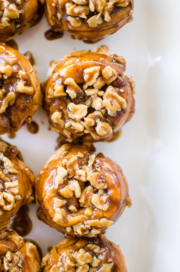 Use store-bought croissants for a simple hack for gooey croissant cinnamon buns with a sticky, pecan topping. | livinglou.com