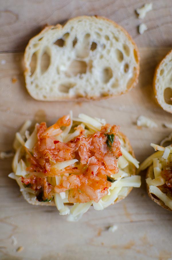 Add kimchi, honey and cheese together for the perfect, sweet, spicy and savoury sandwich. These mini kimchi grilled cheeses are the perfect appetizer. | livinglou.com