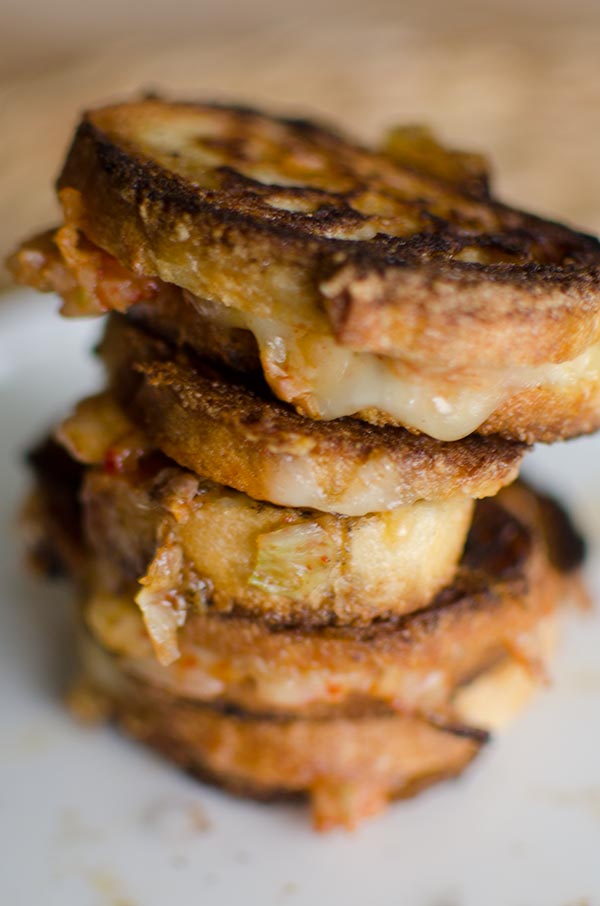 Add kimchi, honey and cheese together for the perfect, sweet, spicy and savoury sandwich. These mini kimchi grilled cheeses are the perfect appetizer. | livinglou.com