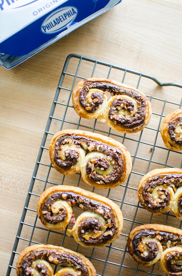 Puff pastry palmiers are an impressive dessert that are so easy to make with frozen puff pastry, chocolate, pecans and cream cheese. | livinglou.com