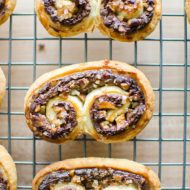 Puff pastry chocolate pecan palmers are an impressive dessert that are so easy to make with frozen puff pastry, chocolate, pecans and cream cheese. | livinglou.com