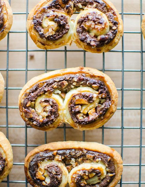 Puff pastry chocolate pecan palmers are an impressive dessert that are so easy to make with frozen puff pastry, chocolate, pecans and cream cheese. | livinglou.com