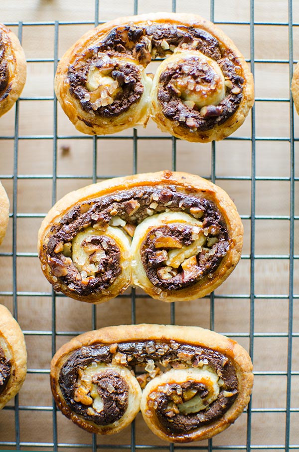 Puff pastry palmiers are an impressive dessert that are so easy to make with frozen puff pastry, chocolate, pecans and cream cheese. | livinglou.com