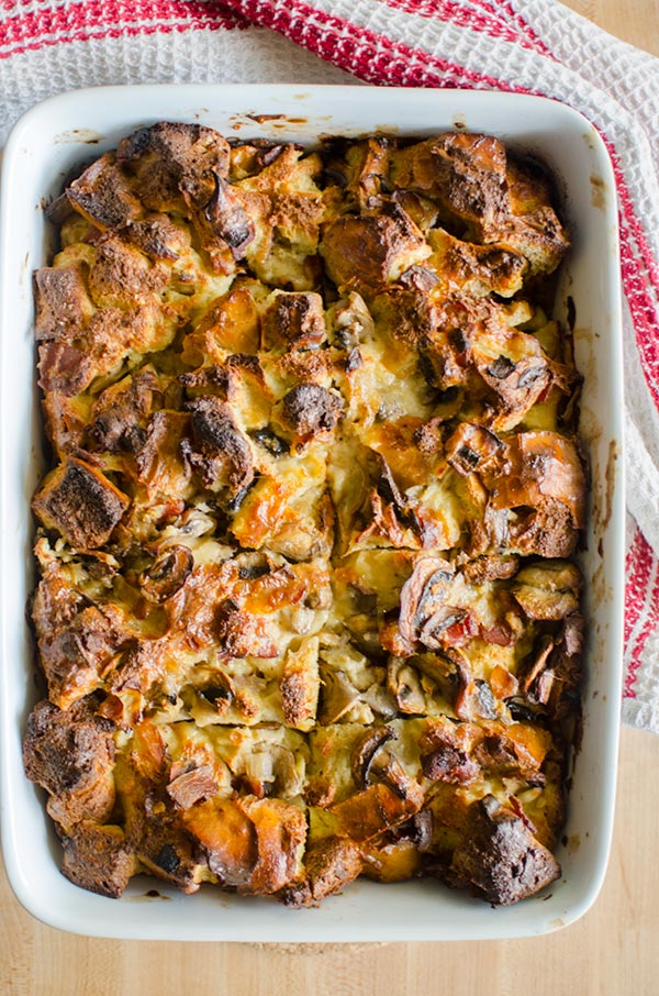 Serve the ultimate holiday brunch with this no-fuss and simple recipe for overnight smoked cheddar, bacon and mushroom strata. | livinglou.com