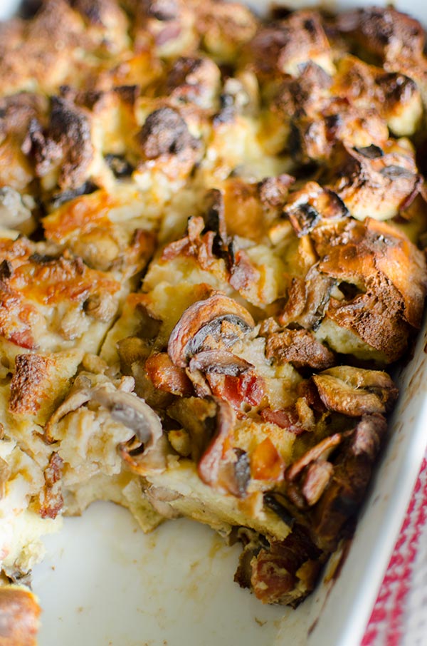 Serve the ultimate holiday brunch with this no-fuss and simple recipe for overnight smoked cheddar, bacon and mushroom strata. | livinglou.com