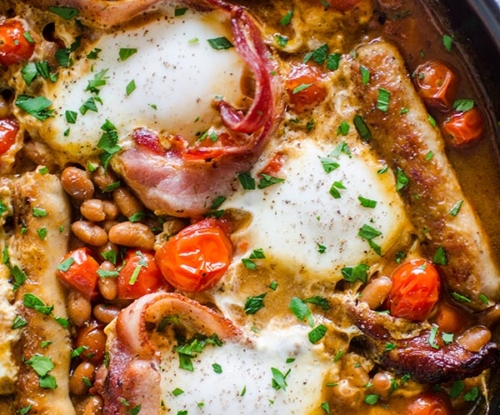 A full English breakfast in a frying pan.