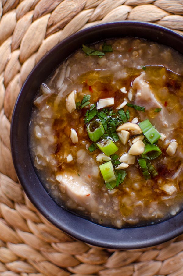 Make brown rice congee in the slow cooker with ginger and chicken. | livinglou.com