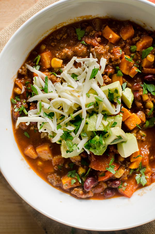 The best homemade beef and beer chili recipe is perfect for dinner this week with corn, sweet potatoes, kidney beans and stout beer. | livinglou.com
