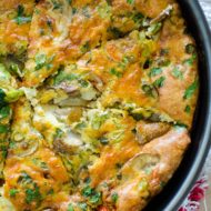 Blistered tomato and mushroom frittata in the pan