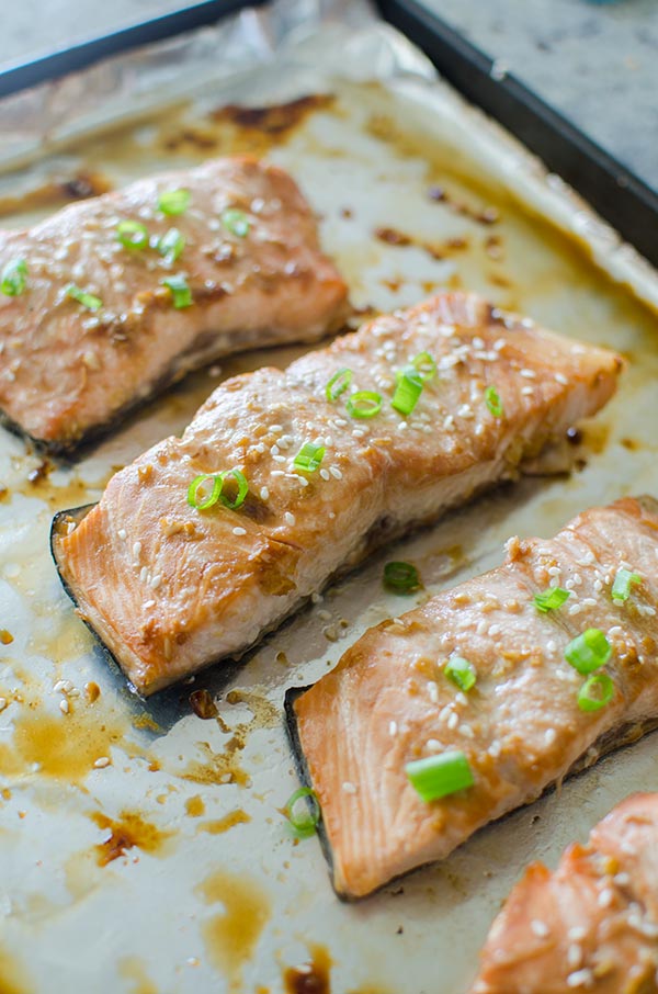 Get dinner together quickly with this simple recipe for roasted teriyaki salmon with a homemade teriyaki sauce made with soy sauce, ginger and garlic.