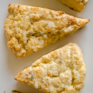 Light and fluffy homemade lemon scones with a lemon glaze and sprinkled with lavender. | livinglou.com
