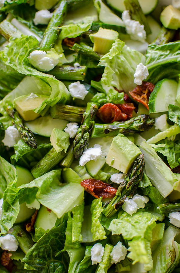 Grilled asparagus salad with basil vinaigrette is the perfect early summer salad with avocado, goats cheese and sundried tomatoes. | livinglou.com