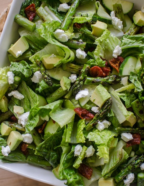 Grilled asparagus salad with basil vinaigrette is the perfect early summer salad with avocado, goats cheese and sundried tomatoes. | livinglou.com