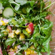 Charred corn and arugula salad with peaches is the perfect bright summer salad with basil and feta. | livinglou.com