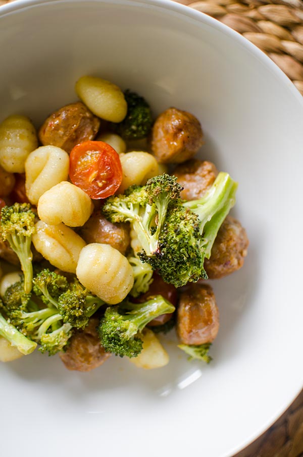 Sheet pan oven baked gnocchi with sausage and vegetables is a quick dinner made in one pan. | livinglou.com