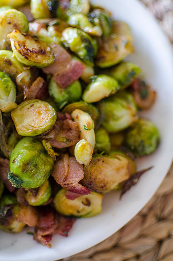 Make the best Brussels sprouts this holiday season with this recipe for Brussels sprouts with bacon and onions with sage and maple syrup. | livinglou.com