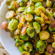 Cooked Brussels sprouts in a white bowl
