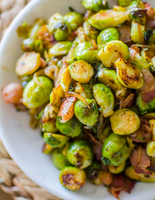 Cooked Brussels sprouts in a white bowl