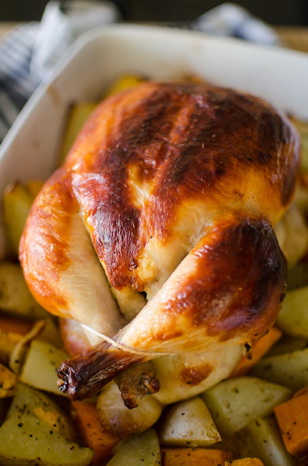 Buttermilk roast chicken is a simple recipe for the most tender, juicy roast chicken with dark, crispy skin. Marinate overnight in a mixture of buttermilk, herbs, garlic, salt and pepper for a juicy and tender roast chicken. | livinglou.com