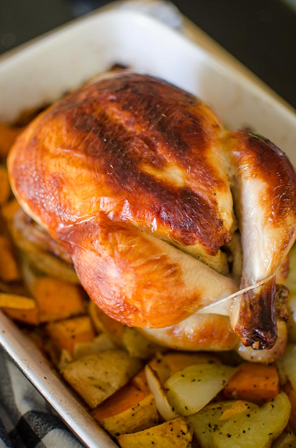 Buttermilk roast chicken is a simple recipe for the most tender, juicy roast chicken with dark, crispy skin. Marinate overnight in a mixture of buttermilk, herbs, garlic, salt and pepper for a juicy and tender roast chicken. | livinglou.com