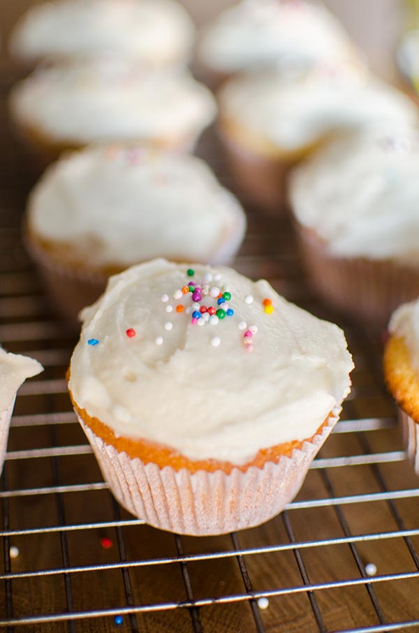 The easiest homemade cupcakes in the world with simple vanilla frosting. | livinglou.com